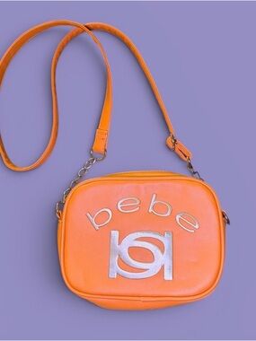 Bebe Bright Orange Crossbody Bag with Silver Logo